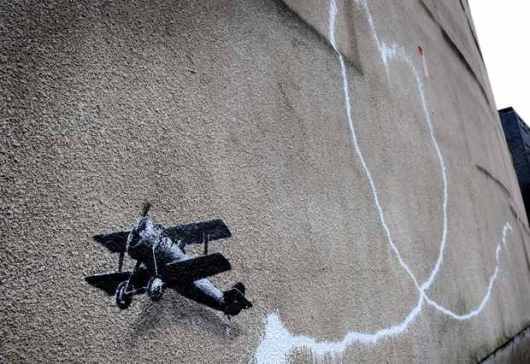 Banksy's Biplane: Love is in Liverpool.